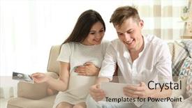  Presentation with ultrasound - PPT layouts with beautiful young pregnant couple looking at ultrasound image while sitting on sofa background and a coral colored foreground