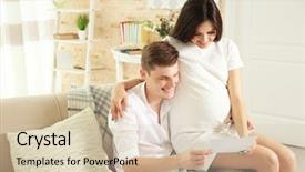  Presentation with ultrasound - Slides having beautiful young pregnant couple looking at ultrasound image while sitting on sofa background and a soft green colored foreground