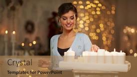  Presentation with christmas candles - Cool new slide deck with beautiful young woman lighting candles in front of fireplace in a dark room with christmas lights backdrop and a coral colored foreground