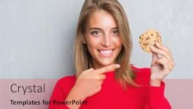  Presentation with chocolate chip - Cool new theme with beautiful young woman over grunge grey wall eating chocolate chip cooky very happy pointing with hand and finger backdrop and a red colored foreground