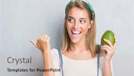  Presentation with mango - Cool new theme with beautiful young woman over grunge grey wall holding fresh mango pointing and showing with thumb up to the side with happy face smiling backdrop and a lemonade colored foreground