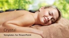 Presentation with green relaxation - Slides enhanced with beauty wellness and relaxation concept - close up of beautiful young woman having hot stone massage in spa over green natural background background and a coral colored foreground