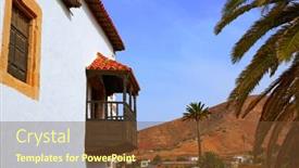 Presentation with village - PPT theme consisting of betancuria-village-fuerteventura-at-canary background and a tawny brown colored foreground