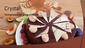  Presentation with table grape - Audience pleasing PPT theme consisting of big whole frost chocolate cream brownie cake topped with white chocolate and cream flowers with hot tea cup decorated with fruits apple plum and grape on plate on wooden table backdrop and a coral colored foreground