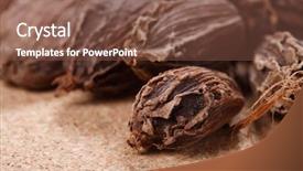  Presentation with cardamom - Theme having black cardamom pods on wood background and a tawny brown colored foreground
