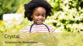  Presentation with black child - Beautiful presentation theme featuring black child - boy looking at his camera backdrop and a yellow colored foreground