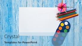  Presentation with paint art - Amazing PPT theme having blank-sheet-colored-pencils-paints backdrop and a light blue colored foreground
