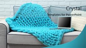  Presentation with knitted knitting needle - Presentation enhanced with blanket on sofa on home background and a light blue colored foreground