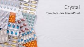  Presentation with packs - Amazing PPT theme having blister-packs-with-colourful-medicines backdrop and a sky blue colored foreground