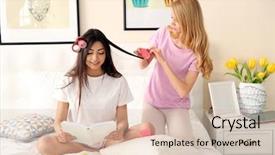  Presentation with curling - Beautiful presentation theme featuring blond girl curling friend's hair with rollers on a bed in living room backdrop and a soft green colored foreground