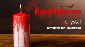  Presentation with halloween candy assorti - PPT theme with bloody candle for halloween holiday on wooden table on dark background background and a tawny brown colored foreground