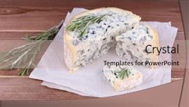  Presentation with blue cheese - Theme with blue cheese with sprigs of rosemary on sheets of paper and wooden table background background and a soft green colored foreground