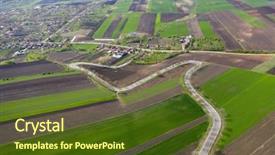  Presentation with agriculture - Presentation theme enhanced with blue green curves - aerial view of curving road background and a tawny brown colored foreground