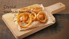  Presentation with onion - PPT theme with board with fried breaded onion rings on wooden background background and a coral colored foreground