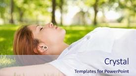  Presentation with grass - Amazing PPT theme having body modification - pretty redhead lying on grass backdrop and a  colored foreground