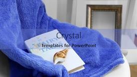  Presentation with seashell - Amazing slide deck having book a seashell and sea blanket on the chair in the room backdrop and a teal colored foreground