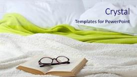  Presentation with book glasses - Audience pleasing PPT theme consisting of book and glasses on bed close-up backdrop and a sky blue colored foreground