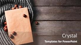  Presentation with hazelnuts - PPT layouts having book-hazelnuts-and-a-woolen background and a tawny brown colored foreground