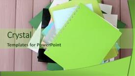  Presentation with magazines - Audience pleasing PPT theme consisting of bookstore advertising - notebook on top of pile backdrop and a  colored foreground