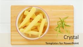  Presentation with sweet corn - Amazing PPT theme having bowl of sweet baby corn backdrop and a yellow colored foreground