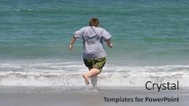  Presentation with swim boy - Beautiful presentation theme featuring boy at the beach running backdrop and a  colored foreground