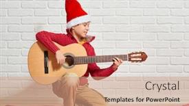  Presentation with red brick wall - Beautiful PPT theme featuring boy playing music on guitar dressed in a red woolen sweater and santa hat sitting on a red checkered blanket white brick wall on background backdrop and a coral colored foreground