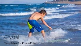  Presentation with surfing - Presentation theme consisting of boy surfer surfing waves on the beach enjoying fun background and a teal colored foreground