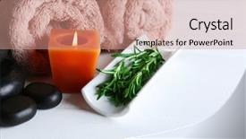  Presentation with spa concept - Presentation enhanced with branches of rosemary towels candle spa stones on color wooden background rosemary spa concept background and a coral colored foreground