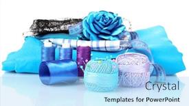  Presentation with yarn - Audience pleasing theme consisting of bright blue yarn fabric satin ribbon and measuring tape isolated on white backdrop and a light blue colored foreground