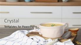  Presentation with cheddar - Audience pleasing theme consisting of broccoli cheddar soup in bowl on wooden board backdrop and a soft green colored foreground