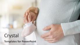  Presentation with baby shoes - Audience pleasing theme consisting of bump with baby girl shoe backdrop and a soft green colored foreground