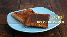  Presentation with burnt - Theme featuring burnt toast bread on turquoise plate on wooden table background background and a tawny brown colored foreground