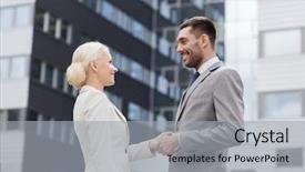  Presentation with partnership - Presentation theme enhanced with business partnership gesture success and people concept - smiling businessman and businesswoman shaking hands over office building background and a light gray colored foreground