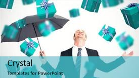  Presentation with under umbrella - PPT theme having businessman sheltering under black umbrella testing against blue and silver presents background and a teal colored foreground