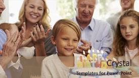  Presentation with birthday boy - PPT theme consisting of cake candles at family party background and a coral colored foreground