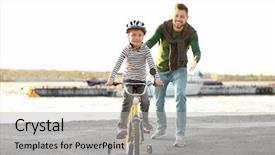  Presentation with teaching - Slide deck having kids walk bike - dad teaching son to ride background and a mint green colored foreground