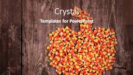  Presentation with corn - Audience pleasing PPT theme consisting of candy corn arranged in a pumpkin shape on a wooden background backdrop and a tawny brown colored foreground