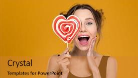 Presentation with lollipop - PPT theme having happy excited young woman covered her eye with bright heart shaped lollipop over yellow background background and a gold colored foreground
