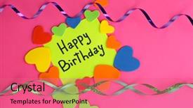  Presentation with birthday card - Audience pleasing PPT layouts consisting of card happy birthday surrounded by festive elements on pink background backdrop and a coral colored foreground