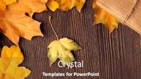  Presentation with cardboard - Presentation theme consisting of cardboard box tied with string on a bow on a wooden background in autumn leaves holiday gift on thanksgiving hellouin view from the top copy space background and a tawny brown colored foreground