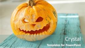  Presentation with spooky - PPT layouts having carving-a-spooky-face background and a seafoam green colored foreground