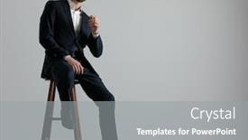  Presentation with navy - Presentation theme consisting of charming formal business man wearing a navy suit and sunglasses sitting with one leg resting on a chair and one hand resting on the leg while looking at camera serious on gray studio background background and a gray colored foreground