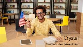  Presentation with united states flag - Colorful slides enhanced with cheerful african american young man holding united states flag sitting in library backdrop and a coral colored foreground