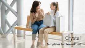  Presentation with females - PPT theme enhanced with cheerful females in casualwear discussing something curious while having rest on bench after shopping in the mall background and a soft green colored foreground