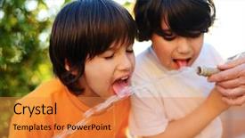  Presentation with water pipe - Audience pleasing PPT theme consisting of cheerful kids having fun drinking water from the pipe outdoors backdrop and a gold colored foreground