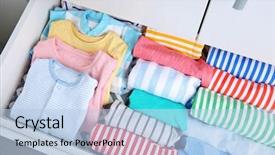  Presentation with baby clothes - Audience pleasing presentation theme consisting of chest of drawers with clothes backdrop and a light blue colored foreground