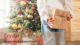  Presentation with child tree - Presentation design enhanced with child near the christmas tree with a gift behind girl back background and a coral colored foreground