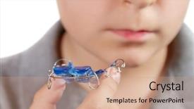  Presentation with orthodontic - PPT layouts having maloclusion - child with orthodontic appliance boy background and a coral colored foreground