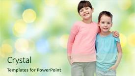  Presentation with green fashion - Slide set consisting of childhood fashion friendship and people concept - happy smiling little girls hugging over summer green lights background background and a soft green colored foreground