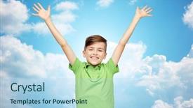  Presentation with green power - PPT theme having childhood fashion power joy and people concept - happy smiling boy in green polo t-shirt raising hands up over blue sky and clouds background background and a light blue colored foreground